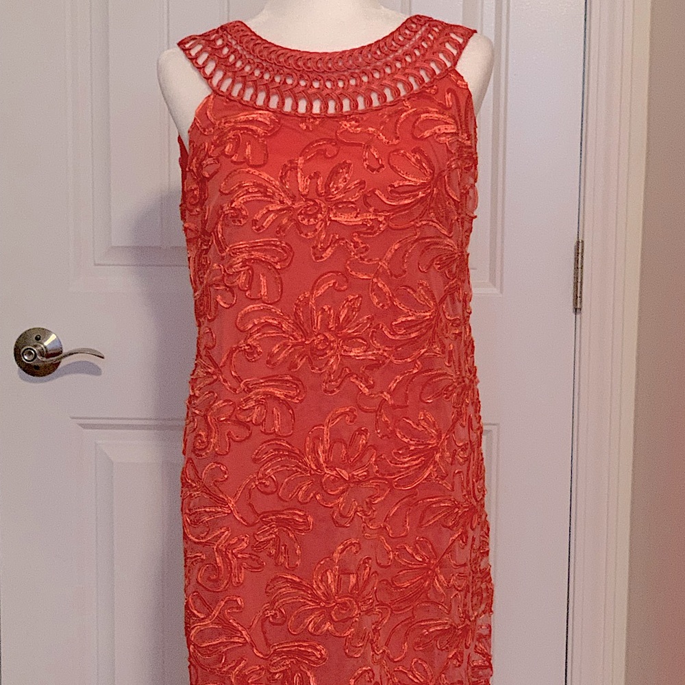 Sleeveless peach/orange colored dress.  Size 14